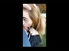 Slut sucks outside